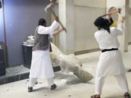 Figure 1. Screenshot of disseminated, reposted, and viral YouTube video of ISIL militants destroy two statues of kings from the ancient city of Hatra in the Mosul Museum.