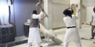 Figure 1. Screenshot of disseminated, reposted, and viral YouTube video of ISIL militants destroy two statues of kings from the ancient city of Hatra in the Mosul Museum.