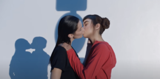 Two females kissing