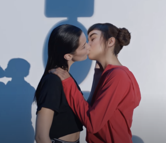 Two females kissing