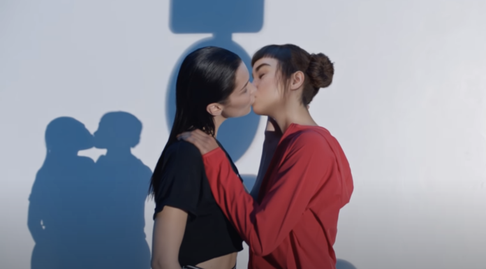 Two females kissing