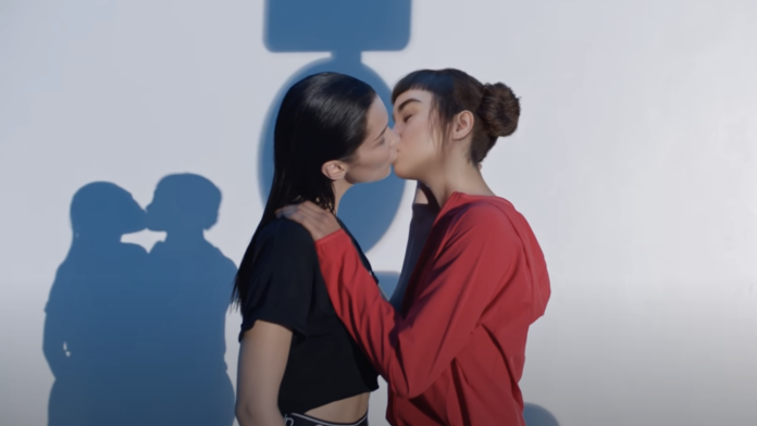 Two females kissing