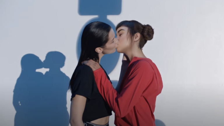 Two females kissing