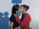 Two females kissing